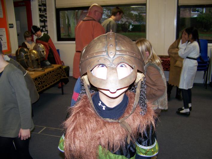 child in a Viking helmet